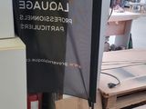 a picture of a sign in a shop with a lot of boxes