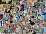 a pile of assorted magnets on a table