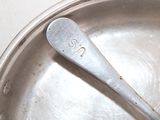 a spoon that is sitting in a pan on the table