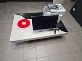 a laptop computer sitting on top of a white table