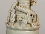 a white vase with a dragon on top of it