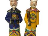 paire de figurines en céramique représentant un homme et une femme