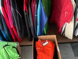 many different types of clothing on display in a store