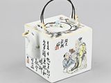 an oriental teapot with a handle and handle in the shape of a box