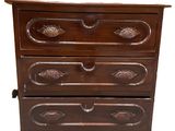 an image of a wooden chest of drawers on a white background
