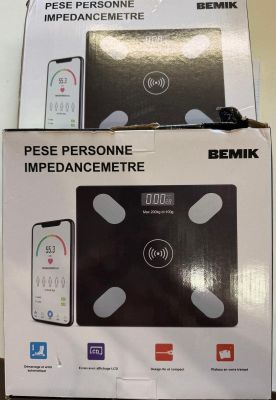 two boxes of electronic devices sitting on top of a table