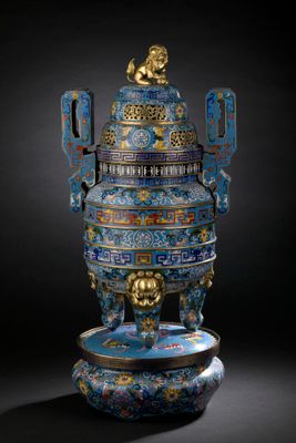 an image of a blue and gold vase with a lion on it