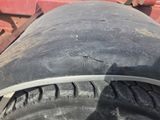 a close up of a tire on the back of a truck