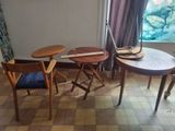 a small table and chairs in a room with a window