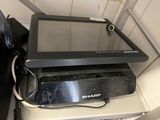 a tablet computer sitting on top of a black box