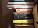 many books stacked on top of each other in a box