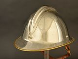 a silver hard hat with a gold band around the brim