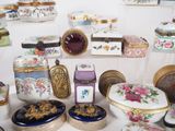 many different types of decorative boxes on the table