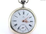 a silver pocket watch with roman numerals on it