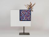 an image of a sculpture of a plant on top of a white box