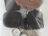 a bag of assorted watches and other items in it