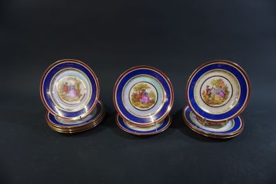 three blue and gold plates with a picture of a man and woman on them