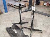a close up of a fork lift in a warehouse with pallets in the background
