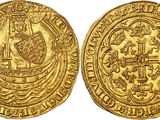 a gold coin with an image of a man and a woman on it