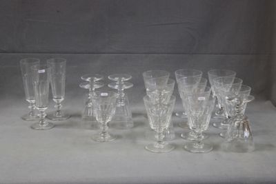 a lot of glasses that are sitting on a table