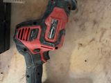 a cordless drill and a cordless saw on the counter