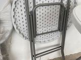 a chair that is sitting next to a table