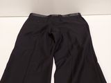 a pair of black pants sitting on top of a white table
