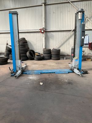 a garage with a lot of tires on the floor
