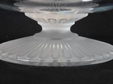 a clear glass bowl with a decorative design on it