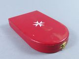 a red case with a star on it on a table