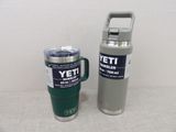 two yeti mugs sitting next to each other on a table