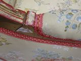 a close up of a purse with a knife in it