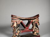 an image of a small wooden stool with a horse on it