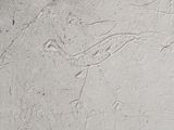 a close up of a wall with some drawings on it