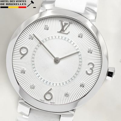 an image of a close up of a wrist watch on a white surface