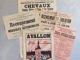 several pamphlets for various vehicles and vehicles are displayed on a refrigerator
