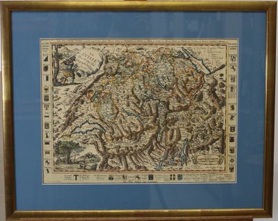 an old map of the mountains is hanging on a wall