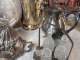 a table with a lot of silver items on it