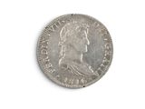 an old silver coin on a white surface with a white background