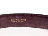 a close up of a brown belt with a gold buckle