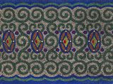 un gros plan sur un tapis orné d'un motif