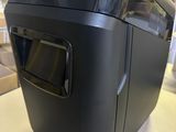 a black machine sitting on a counter in a store