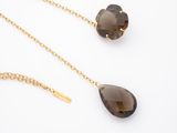 a pair of smoky quartz necklaces and earring set