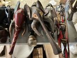 many different types of african masks on a table