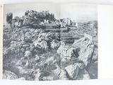 a book with a picture of a castle on top of a hill