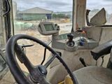 a steering wheel and dashboard of a construction vehicle