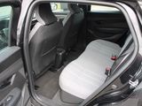 the interior of a car with the door open and the seat up