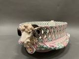a cow that is sitting in a bowl on a table