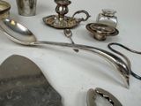 a table with a lot of silver objects on it