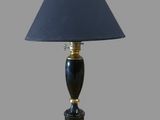 an image of a black lamp with a gold base and a blue shade